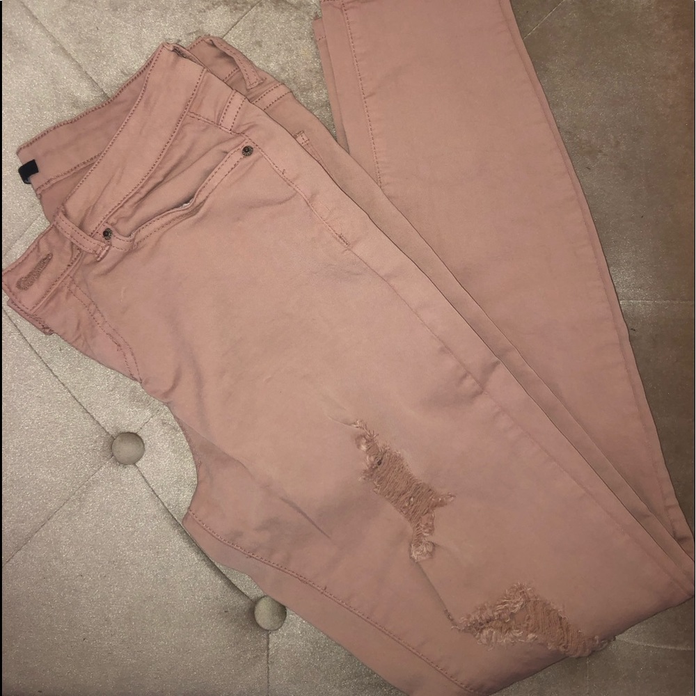 Pink distressed jeans